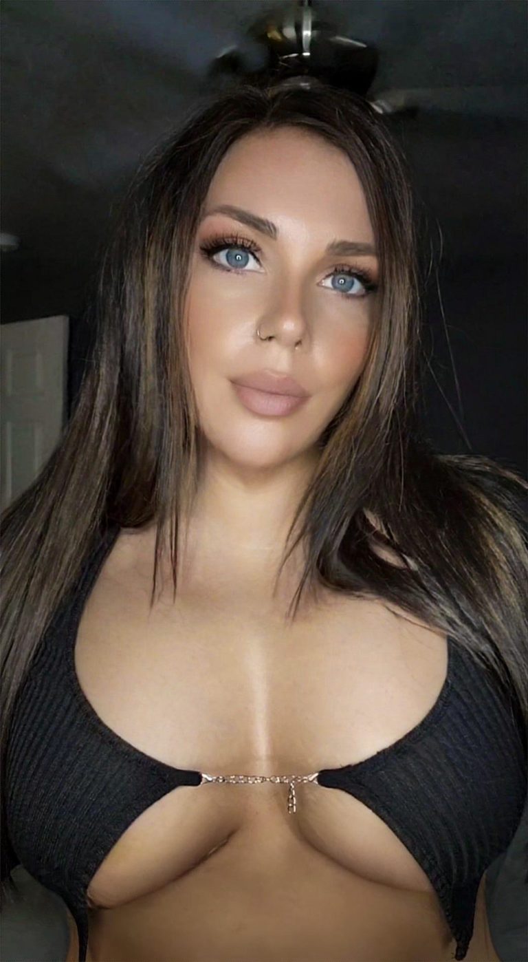 close up selfie of woman in black top