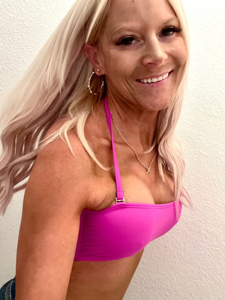 woman in pink bikini smiling