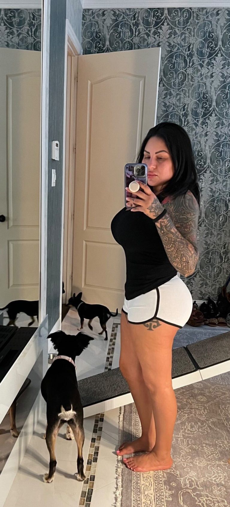 woman posing for selfie with dog