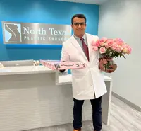 NTPS Doctor posing with flowers 